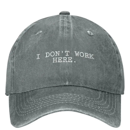 I DON'T WORK HERE Baseball Cap