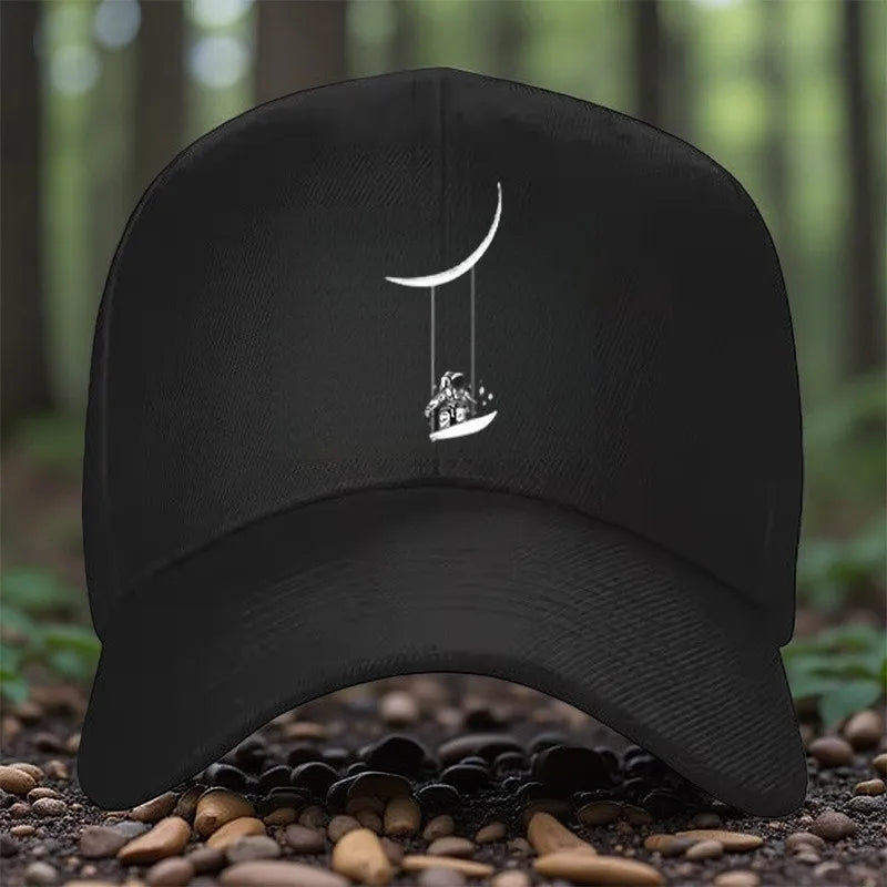 Astronaut Swinging on Moon Graphic Baseball Cap