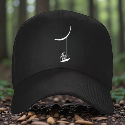 Astronaut Swinging on Moon Graphic Baseball Cap