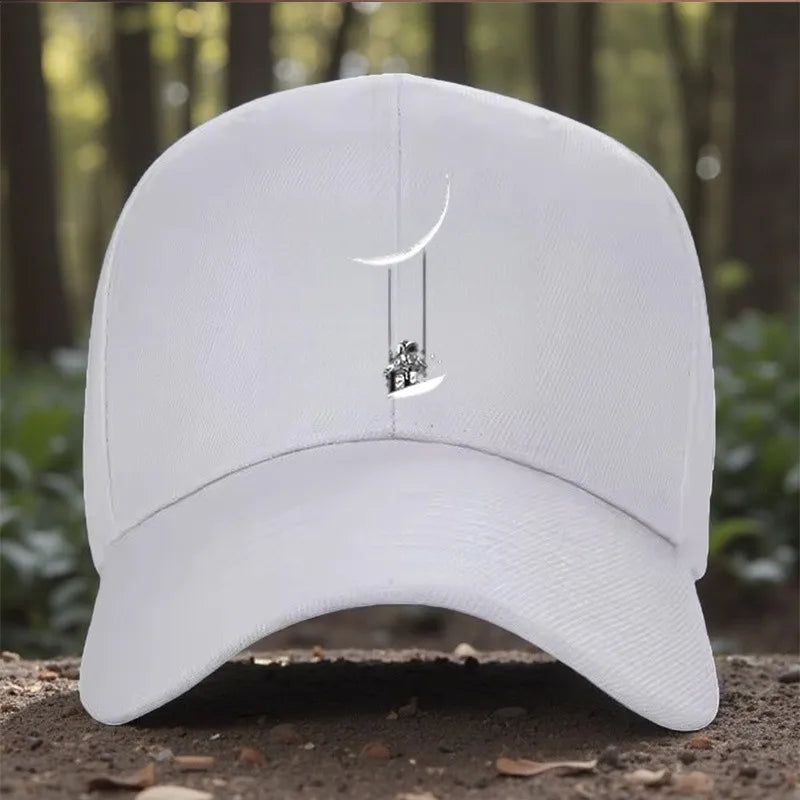 Astronaut Swinging on Moon Graphic Baseball Cap