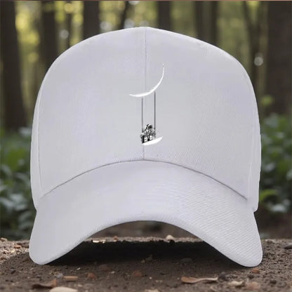 Astronaut Swinging on Moon Graphic Baseball Cap